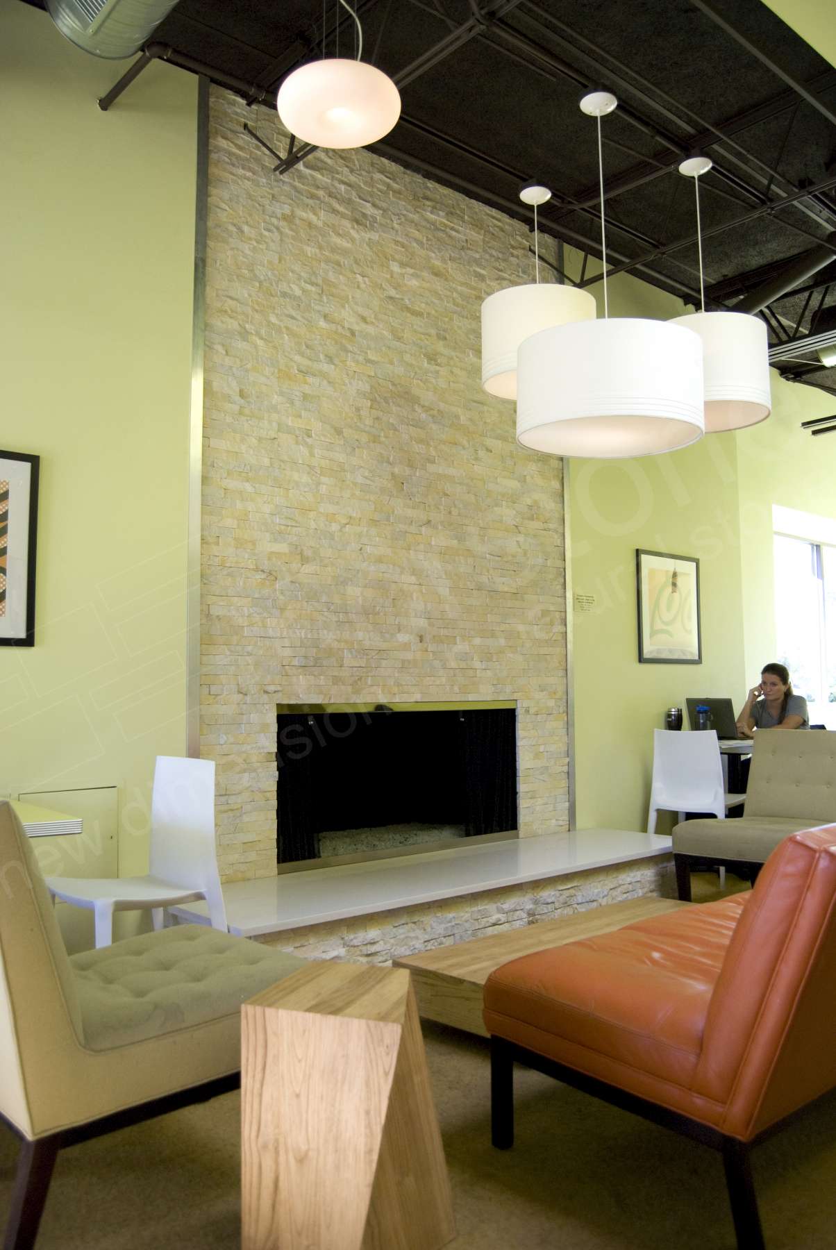 Norstone Ivory Stacked Stone Rock Panels on a fireplace installation with metal trim pieces to cover the exposed edge of the panel